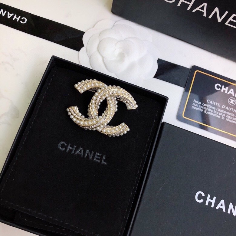 Ch*el brooches